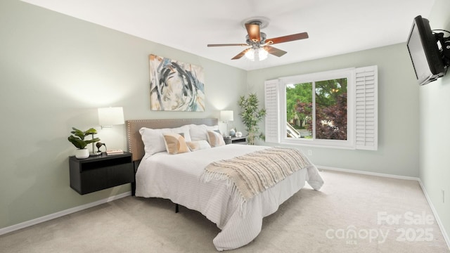 bedroom featuring baseboards, ceiling fan, and carpet floors