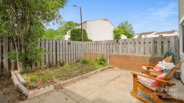 view of patio with a fenced backyard