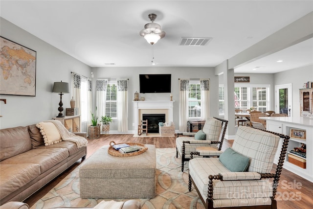 2655 Stonewood Vw, Kannapolis, NC 28081 - living area with a fireplace with flush hearth, light wood-type flooring, ceiling fan, recessed lighting, and baseboards