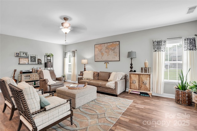2655 Stonewood Vw, Kannapolis, NC 28081 - living area with plenty of natural light, wood finished floors, ceiling fan, and baseboards
