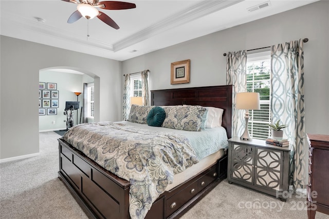 2655 Stonewood Vw, Kannapolis, NC 28081 - bedroom featuring arched walkways, light carpet, multiple windows, ornamental molding, and a raised ceiling