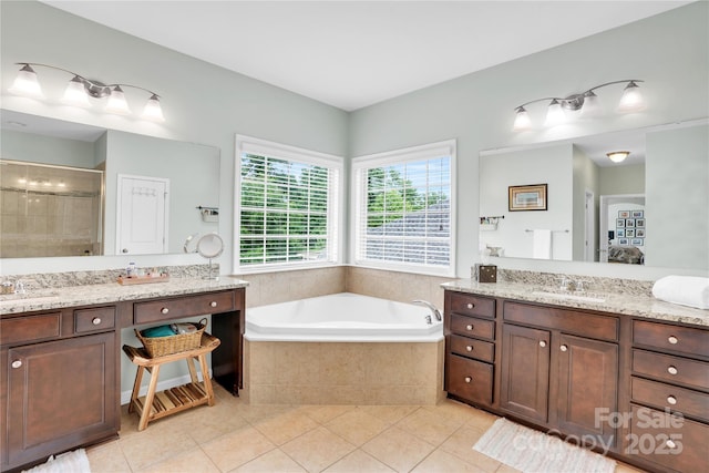 2655 Stonewood Vw, Kannapolis, NC 28081 - bathroom featuring tile patterned floors, a garden tub, tiled shower, and two vanities
