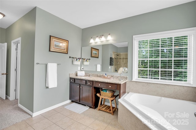 2655 Stonewood Vw, Kannapolis, NC 28081 - bathroom featuring a bath, a stall shower, tile patterned flooring, vanity, and baseboards