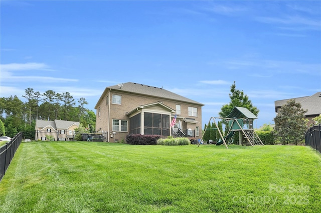2655 Stonewood Vw, Kannapolis, NC 28081 - back of house featuring a playground and a sunroom