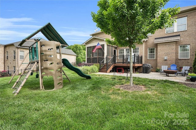 2655 Stonewood Vw, Kannapolis, NC 28081 - view of jungle gym with a sunroom, a patio area, and a yard