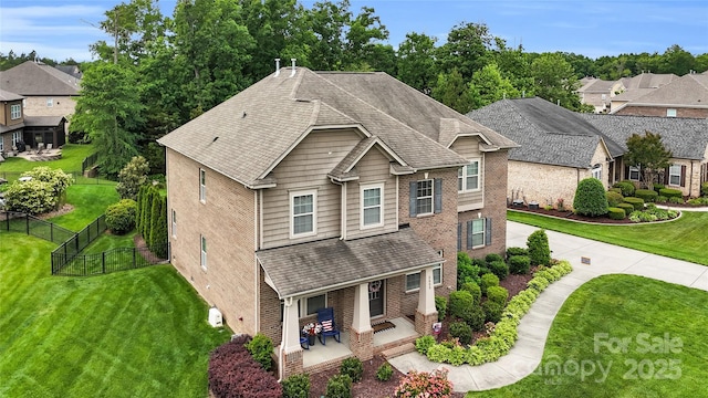 2655 Stonewood Vw, Kannapolis, NC 28081 - view of front of house with a shingled roof, covered porch, brick siding, and a residential view