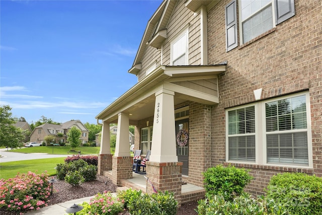 2655 Stonewood Vw, Kannapolis, NC 28081 - entrance to property featuring brick siding, covered porch, a residential view, and a lawn