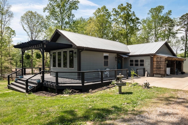 4107 Sandy Plains Rd, Tryon, NC 28782 - view of front of house with metal roof, a front yard, a deck, concrete driveway, and a pergola