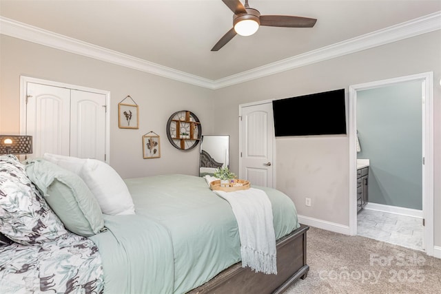 bedroom featuring baseboards, light colored carpet, ceiling fan, crown molding, and ensuite bath