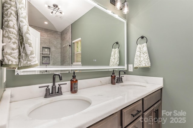 full bathroom featuring a sink, recessed lighting, and double vanity