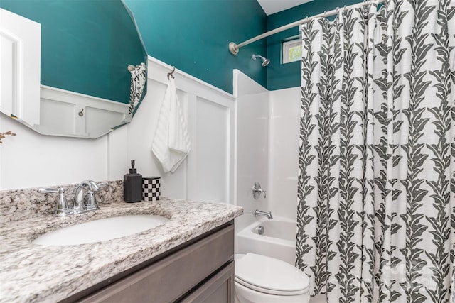 full bath featuring shower / tub combo with curtain, vanity, and toilet