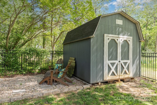 view of shed with a fenced backyard