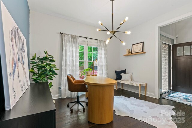 office with a chandelier, dark wood finished floors, and baseboards