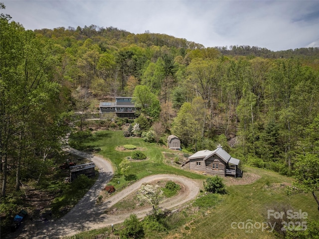 bird's eye view with a forest view