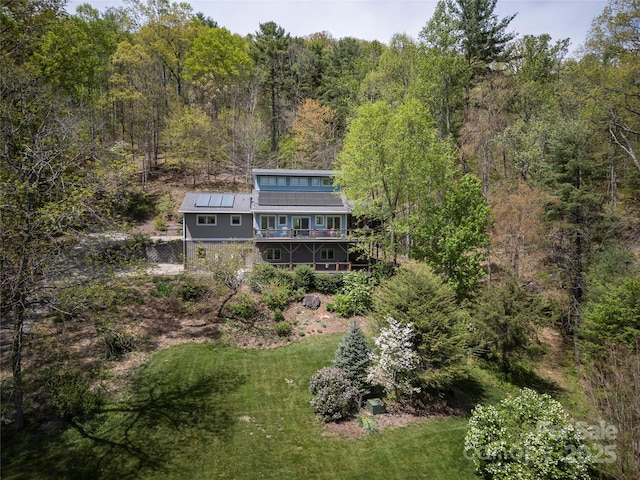 bird's eye view featuring a forest view