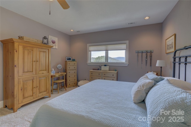 bedroom featuring light colored carpet, a ceiling fan, visible vents, and recessed lighting