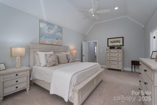 bedroom featuring crown molding, baseboards, ceiling fan, light colored carpet, and vaulted ceiling