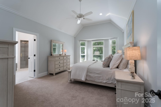 bedroom with carpet flooring, crown molding, ensuite bath, a ceiling fan, and vaulted ceiling