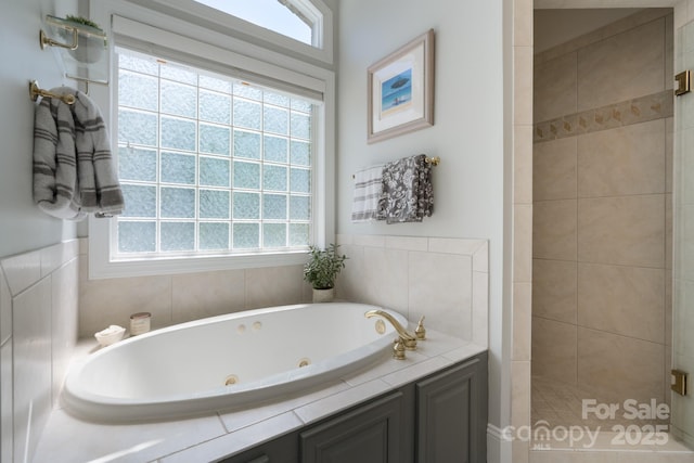 full bath with a tile shower and a tub with jets