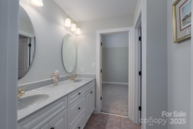 bathroom with a sink, tile patterned floors, and double vanity