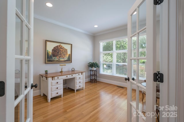 office featuring baseboards, french doors, and light wood-type flooring