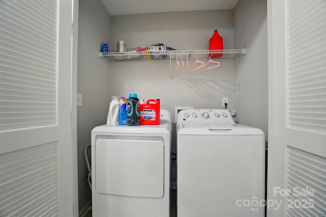 clothes washing area featuring laundry area and washing machine and dryer