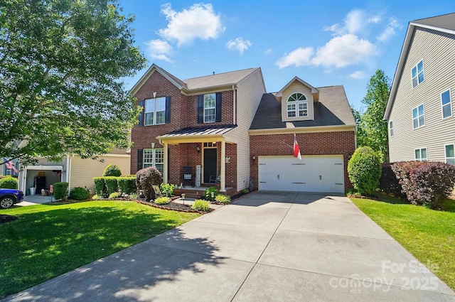 traditional-style house with concrete driveway, a front yard, and brick siding