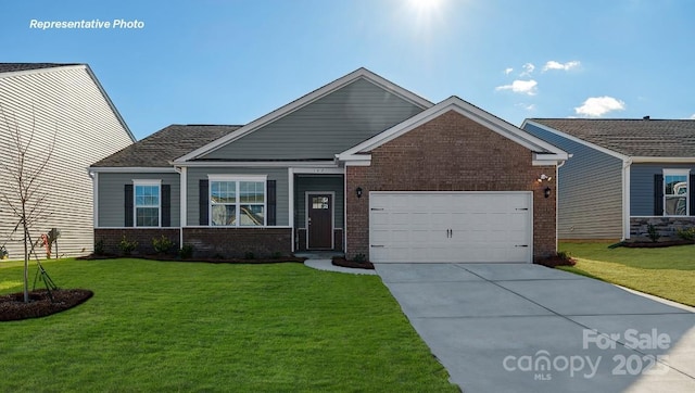 view of front of property featuring brick siding, an attached garage, a front yard, and driveway