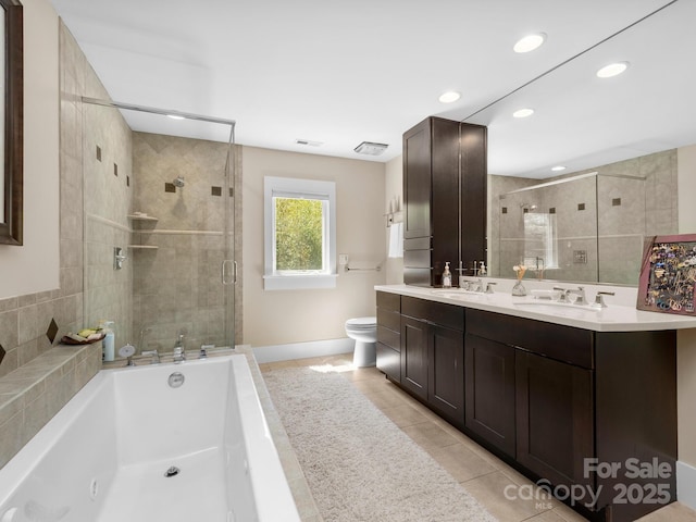 18 Ozark Spring Ln, Asheville, NC 28805 - bathroom featuring a stall shower, double vanity, a garden tub, tile patterned flooring, and toilet
