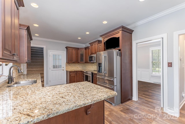 1468 Woodhurst Dr, Rock Hill, SC 29732 - kitchen featuring stainless steel appliances, a peninsula, light wood-style flooring, backsplash, and light stone countertops