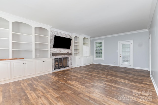 1468 Woodhurst Dr, Rock Hill, SC 29732 - unfurnished living room featuring dark wood-style flooring, a fireplace, built in shelves, and ornamental molding