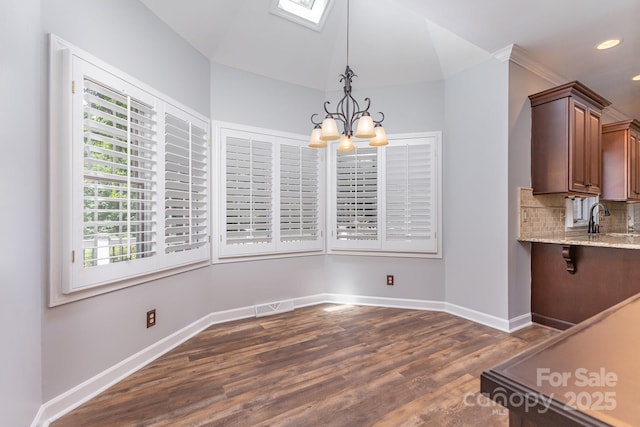 1468 Woodhurst Dr, Rock Hill, SC 29732 - unfurnished dining area with a chandelier, dark wood-style flooring, recessed lighting, and a skylight