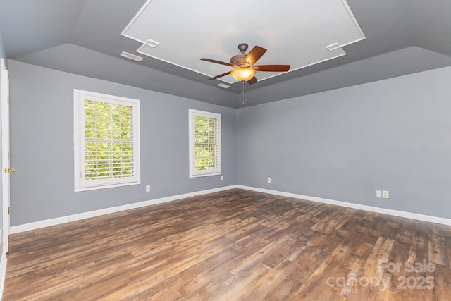 1468 Woodhurst Dr, Rock Hill, SC 29732 - spare room featuring lofted ceiling, dark wood-type flooring, ceiling fan, and attic access