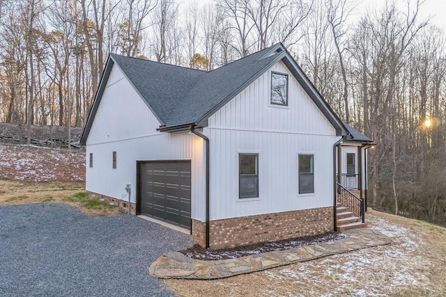 252 Big Lick Rd, Stanfield, NC 28163 - view of property exterior with a garage, roof with shingles, and gravel driveway