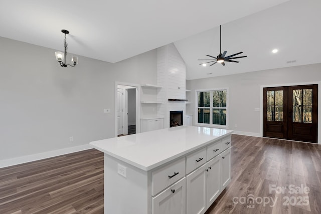 252 Big Lick Rd, Stanfield, NC 28163 - kitchen featuring white cabinets, open floor plan, wood finished floors, and a kitchen island