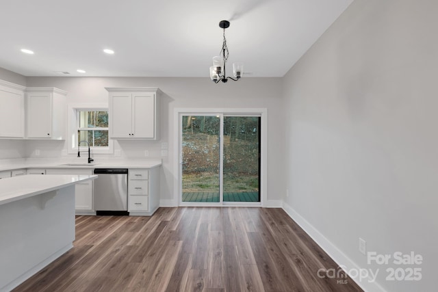 252 Big Lick Rd, Stanfield, NC 28163 - kitchen featuring white cabinets, light countertops, stainless steel dishwasher, a sink, and a chandelier