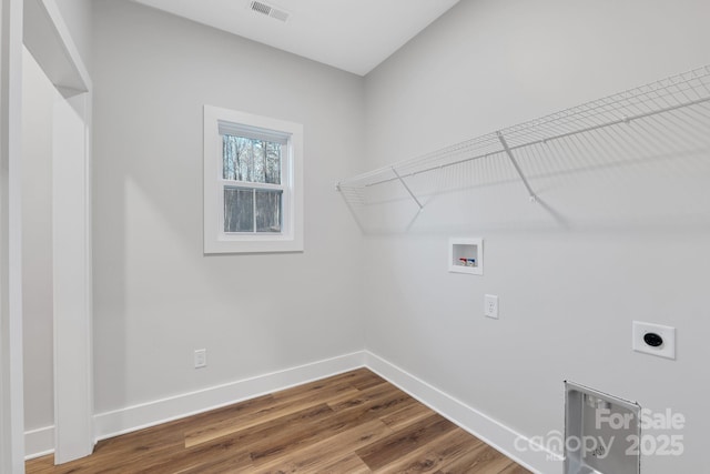 252 Big Lick Rd, Stanfield, NC 28163 - laundry room with hookup for a washing machine, hookup for an electric dryer, laundry area, baseboards, and visible vents