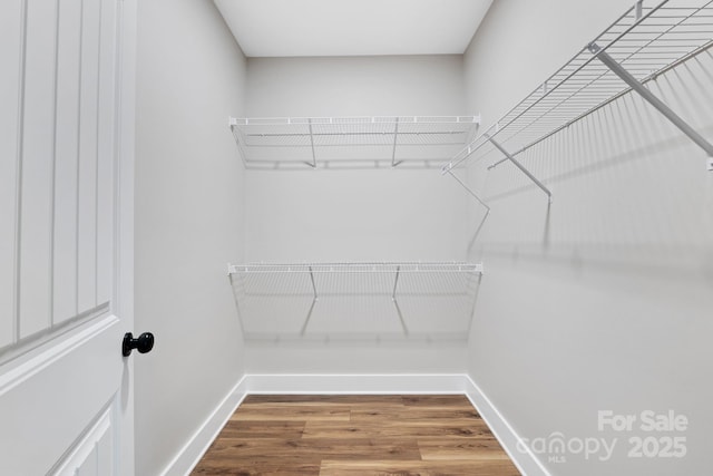 252 Big Lick Rd, Stanfield, NC 28163 - walk in closet featuring wood finished floors