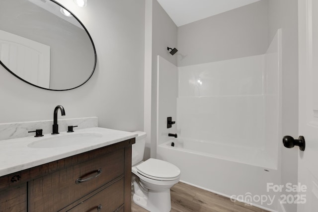 252 Big Lick Rd, Stanfield, NC 28163 - bathroom featuring toilet, vanity, wood finished floors, and  shower combination