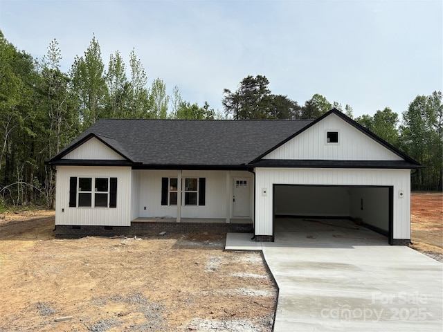 modern farmhouse style home featuring a porch, crawl space, concrete driveway, an attached garage, and a shingled roof