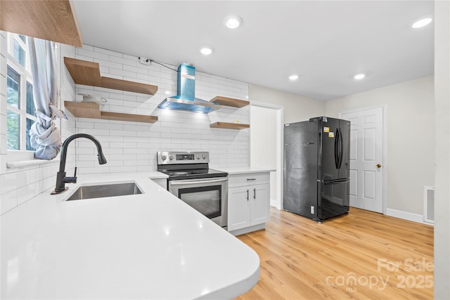 1053 Stoneybrook Ln, Rock Hill, SC 29730 - kitchen featuring freestanding refrigerator, stainless steel electric range oven, open shelves, wall chimney range hood, and tasteful backsplash