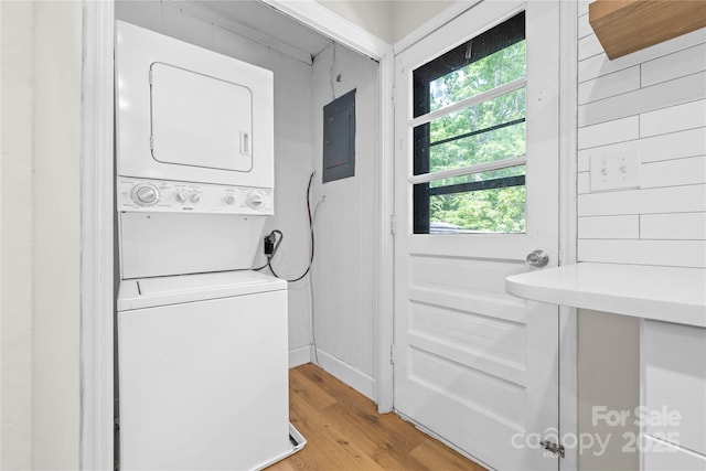 1053 Stoneybrook Ln, Rock Hill, SC 29730 - washroom featuring stacked washing machine and dryer, electric panel, and light wood-style floors