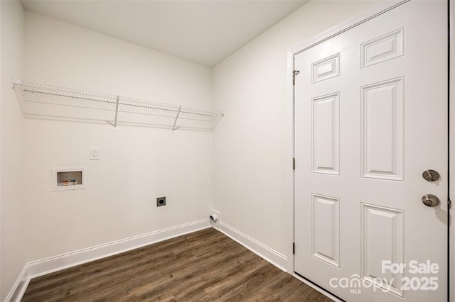 washroom with dark wood finished floors, hookup for a washing machine, baseboards, and laundry area