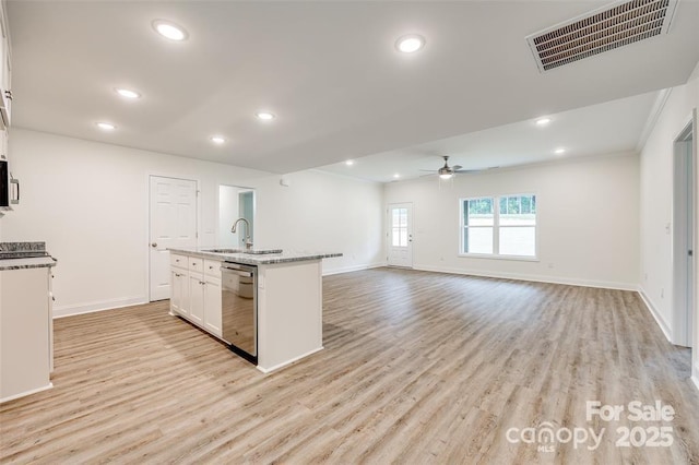 kitchen with dishwasher, visible vents, baseboards, and ceiling fan