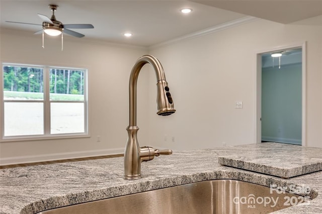 interior details featuring recessed lighting, light countertops, ornamental molding, a sink, and ceiling fan