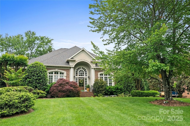 3420 Maryhurst Ln, Charlotte, NC 28226 - view of front facade with a front lawn, a shingled roof, and brick siding