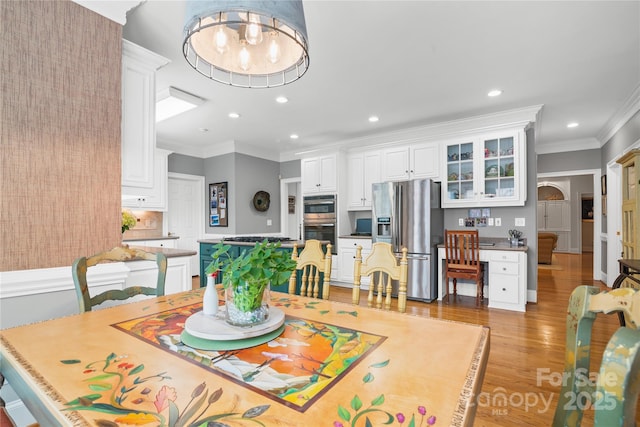 3420 Maryhurst Ln, Charlotte, NC 28226 - dining room featuring ornamental molding, light wood finished floors, and recessed lighting