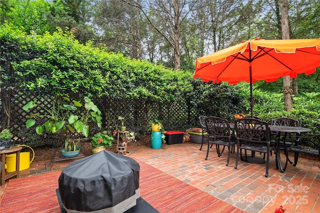 3420 Maryhurst Ln, Charlotte, NC 28226 - view of patio / terrace featuring outdoor dining space and view of wooded area