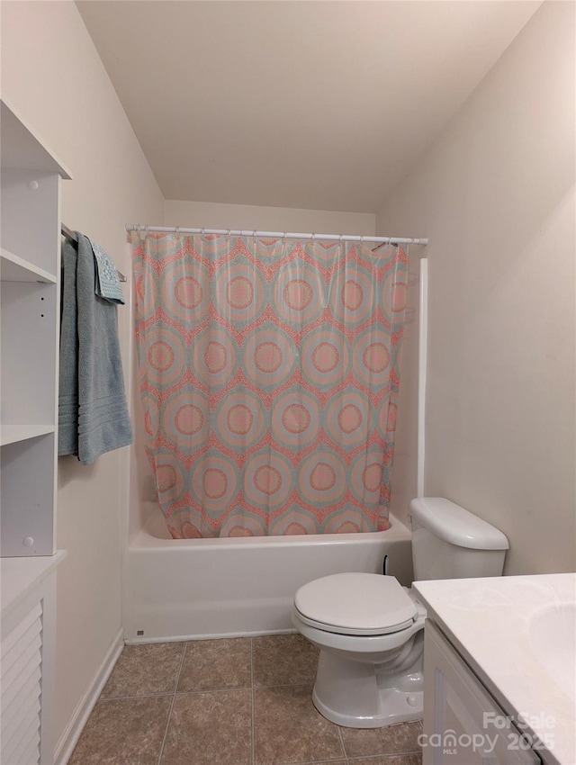 full bath with vanity, toilet, tile patterned floors, and shower / bath combo with shower curtain