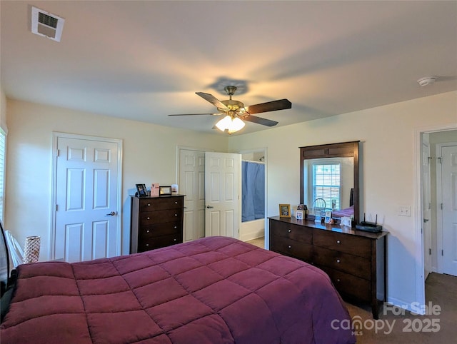bedroom featuring visible vents, a ceiling fan, carpet, and baseboards